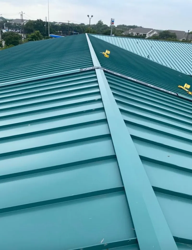 Green commercial metal roof ridge and valley for Metal Roof Repair in Northampton